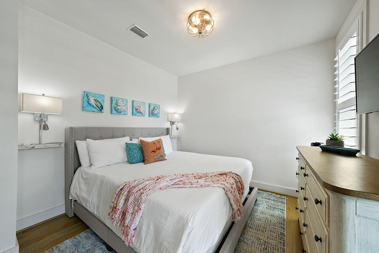 54 Dune Drive Santa Rosa Beach, FL 32459 - Photo 9 of 42 a bedroom with a bed and a table in it