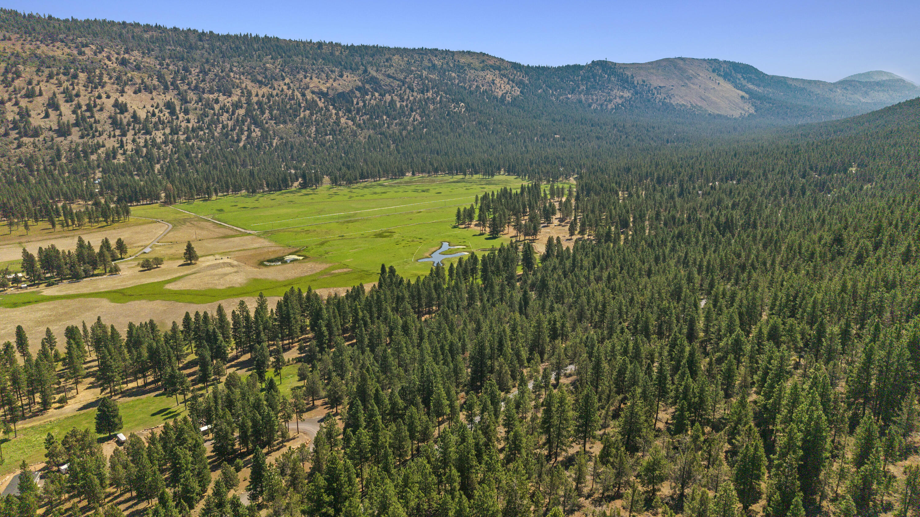 0 Simpson Canyon Road, Unit 15 Klamath Falls, OR 97601 - Photo 32 of 37 a view of a lush green hillside and houses