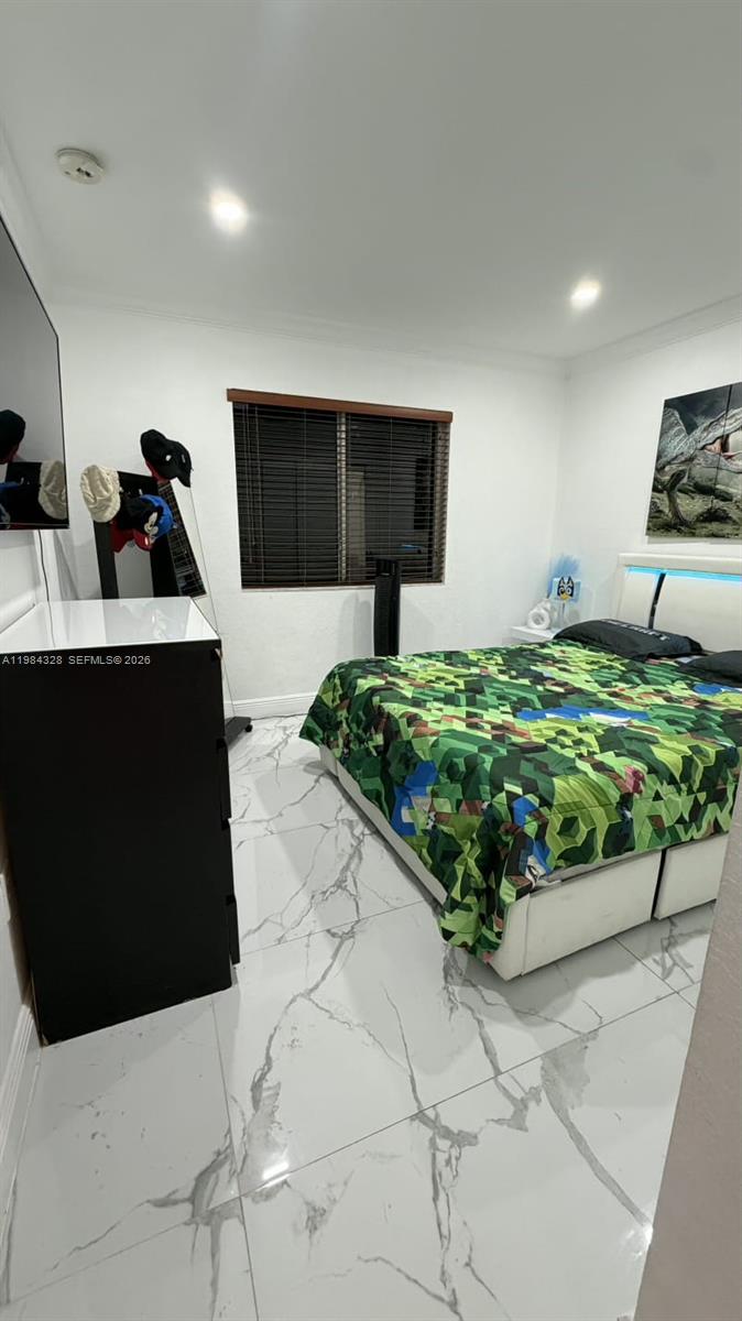 25209 Southwest 134th Avenue Homestead, FL 33032 - Photo 17 of 33 a bed room with a bed and a television