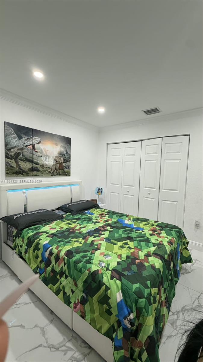 25209 Southwest 134th Avenue Homestead, FL 33032 - Photo 18 of 33 a bed room with a bed and a painting