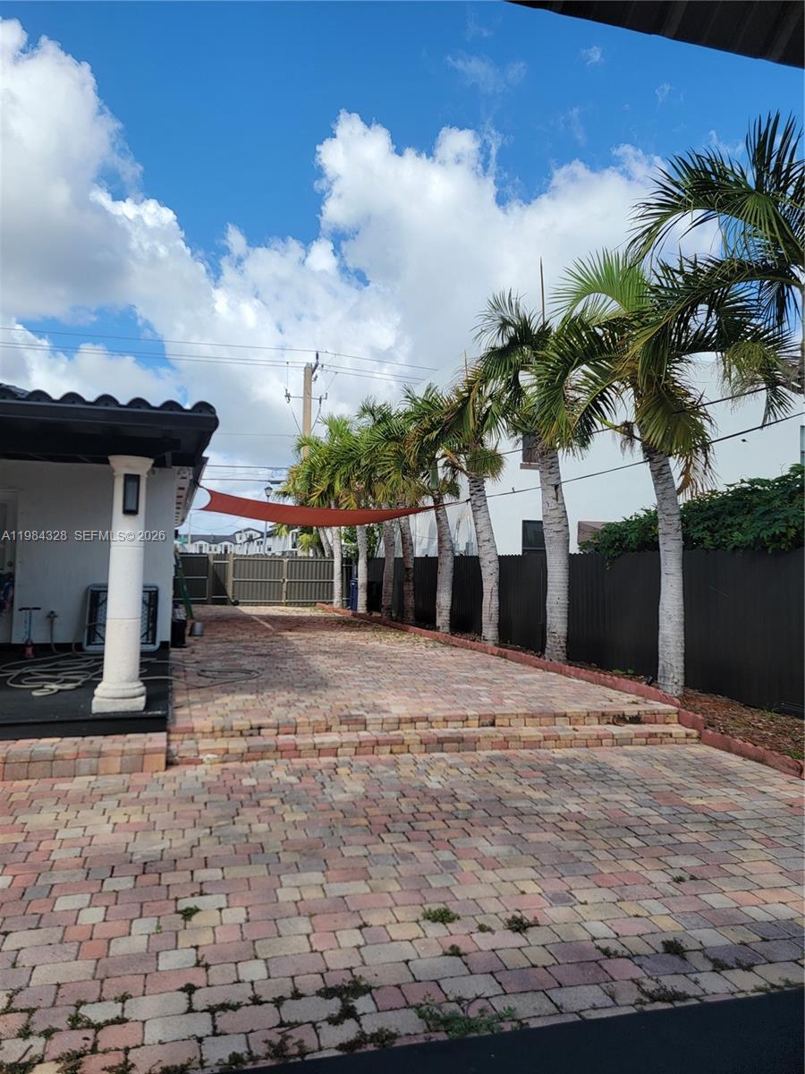 25209 Southwest 134th Avenue Homestead, FL 33032 - Photo 29 of 33 a view of a house with a patio