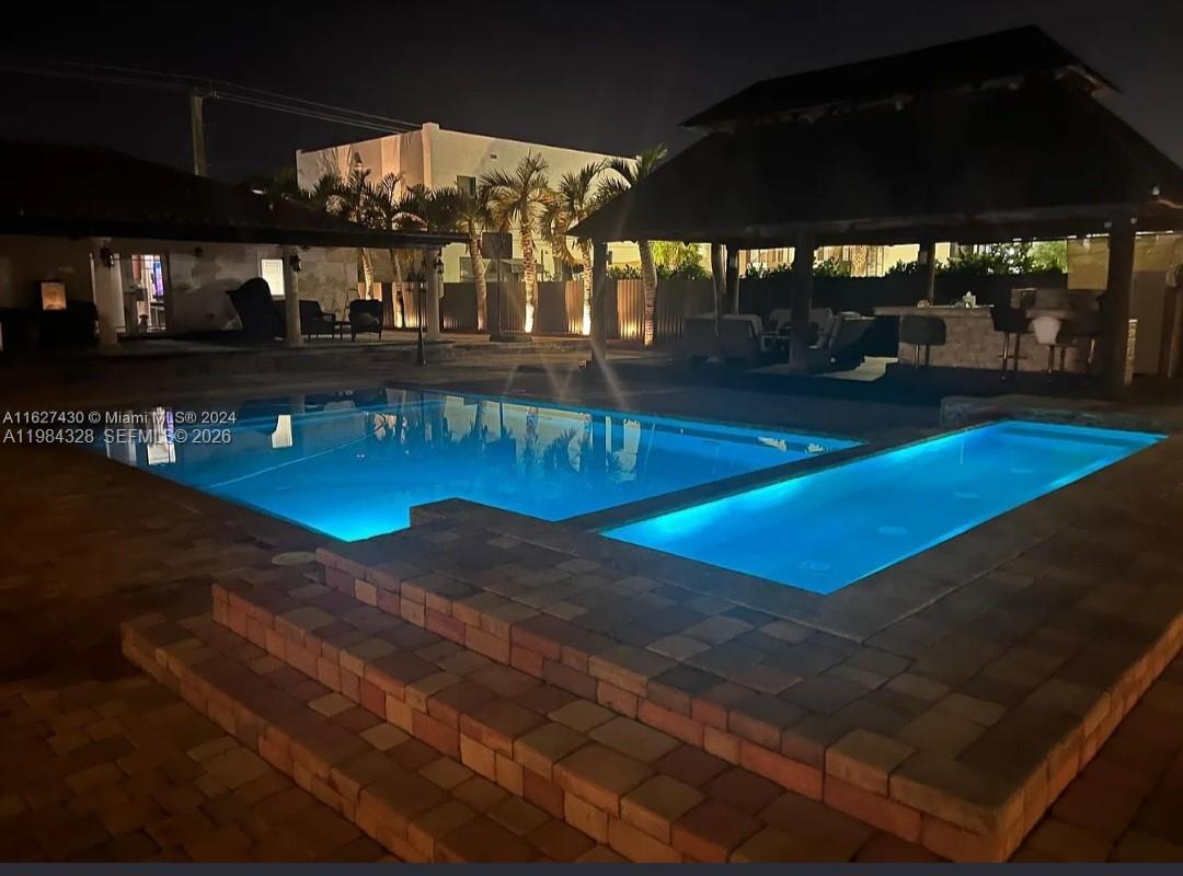 25209 Southwest 134th Avenue Homestead, FL 33032 - Photo 31 of 33 a view of swimming pool with outdoor seating