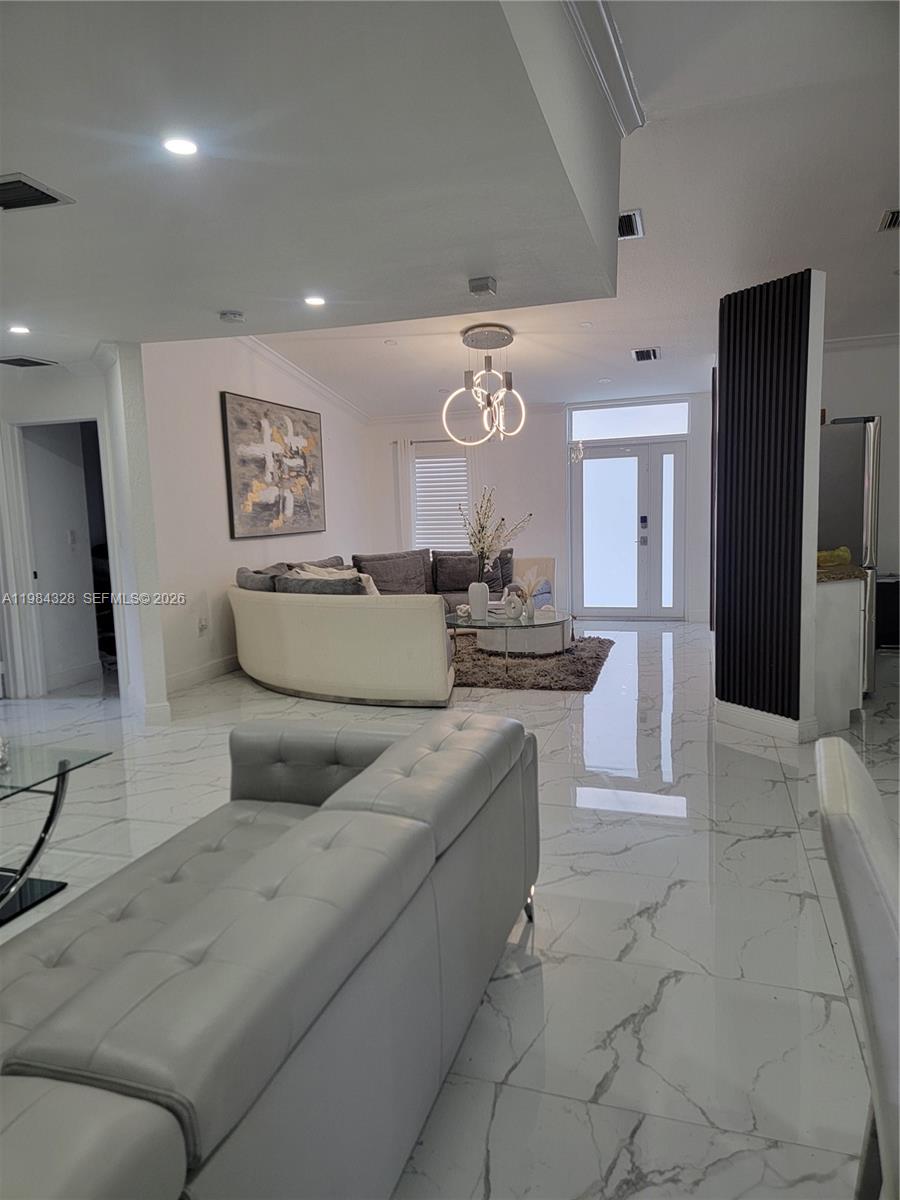 25209 Southwest 134th Avenue Homestead, FL 33032 - Photo 10 of 33 a living room with furniture and a kitchen