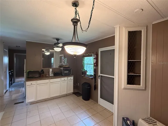 a kitchen with a sink stainless steel appliances and cabinets