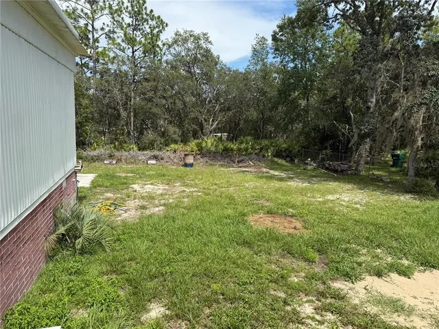 a view of swimming pool with a yard