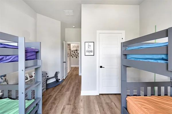 a bedroom with furniture and a rug