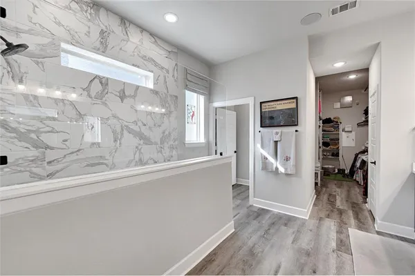 a spacious bathroom with a sink a mirror and vanity