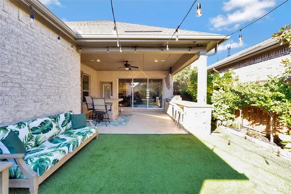 a view of a backyard with plants and a garden