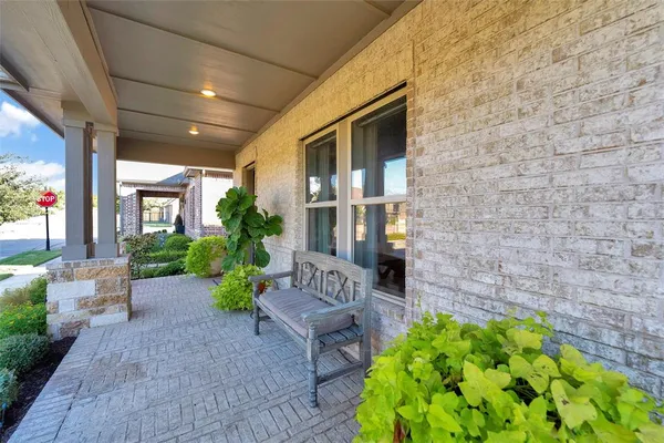 a view of an chairs and table in the patio