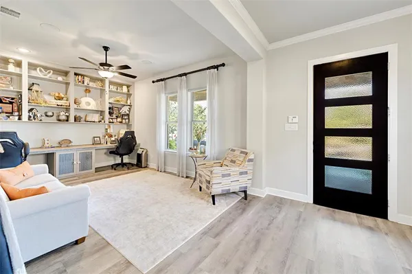 a very nice looking room with a large window and gym equipment