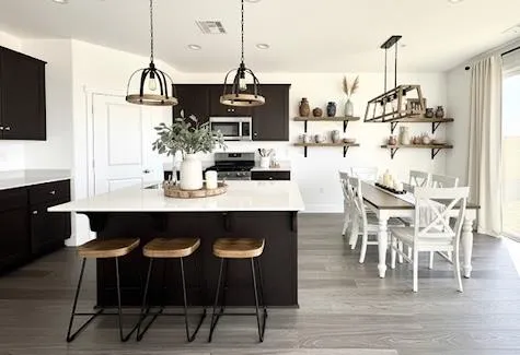 a view of kitchen and dining area with furniture