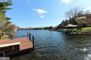 2022 Lakebreeze Way Reston, VA 20191 - Photo 1 of 25 a view of a lake with sitting area
