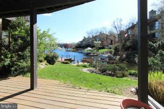 2022 Lakebreeze Way Reston, VA 20191 - Photo 24 of 25 a view of a house with a backyard
