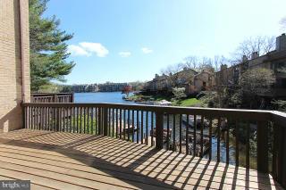 2022 Lakebreeze Way Reston, VA 20191 - Photo 8 of 25 a view of balcony with wooden floor and fence