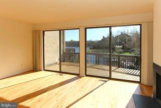 2022 Lakebreeze Way Reston, VA 20191 - Photo 9 of 25 a bedroom with a large window and a bed