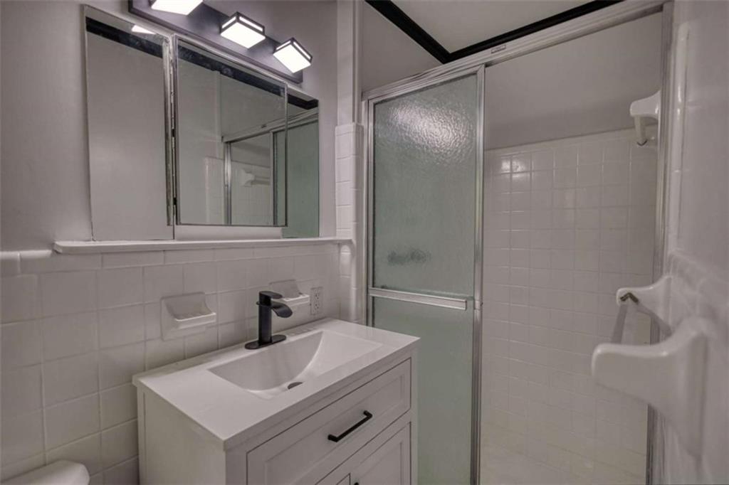 555 Joy Street Jackson, GA 30233 - Photo 43 of 56 a bathroom with a sink toilet and shower