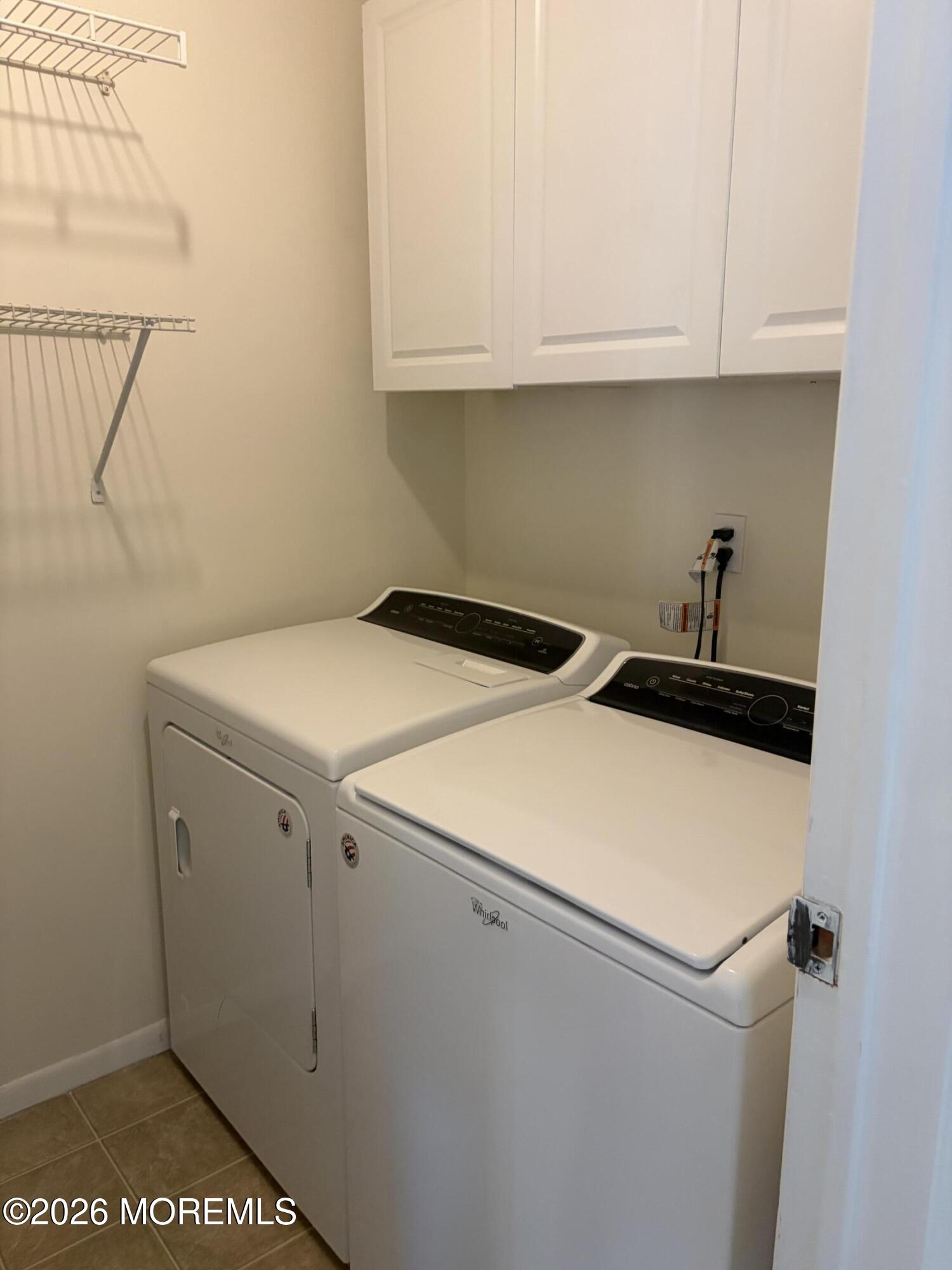 231 Atlantic Street, Unit 33 Keyport, NJ 07735 - Photo 11 of 12 a utility room with dryer and washer