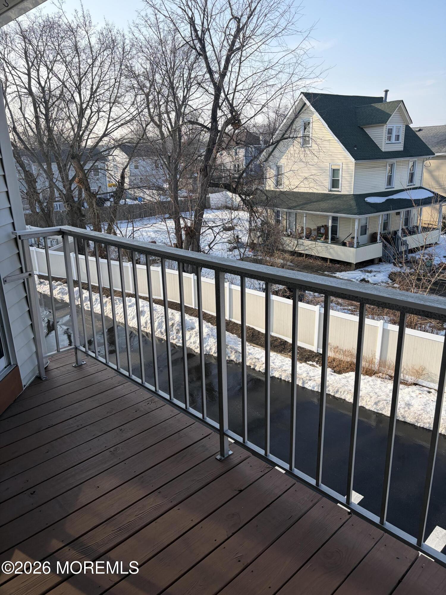 231 Atlantic Street, Unit 33 Keyport, NJ 07735 - Photo 12 of 12 a view of a balcony with wooden floor