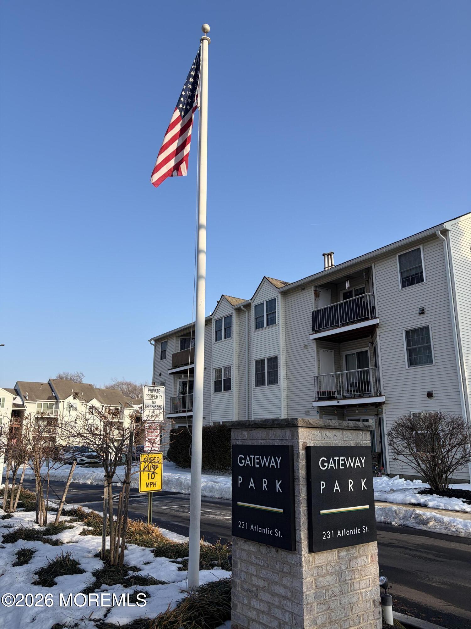 231 Atlantic Street, Unit 33 Keyport, NJ 07735 - Photo 4 of 12 a front view of a building with street