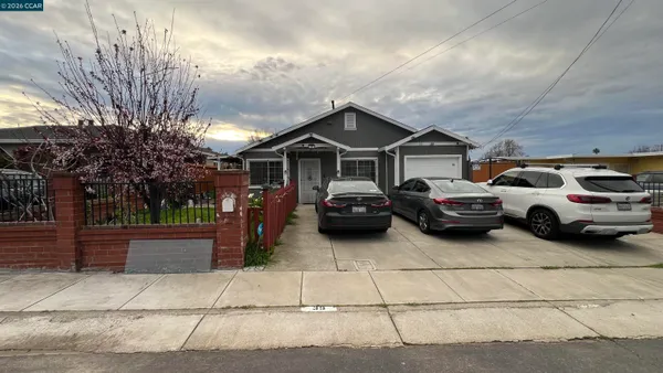 a view of a car parked in front of a house