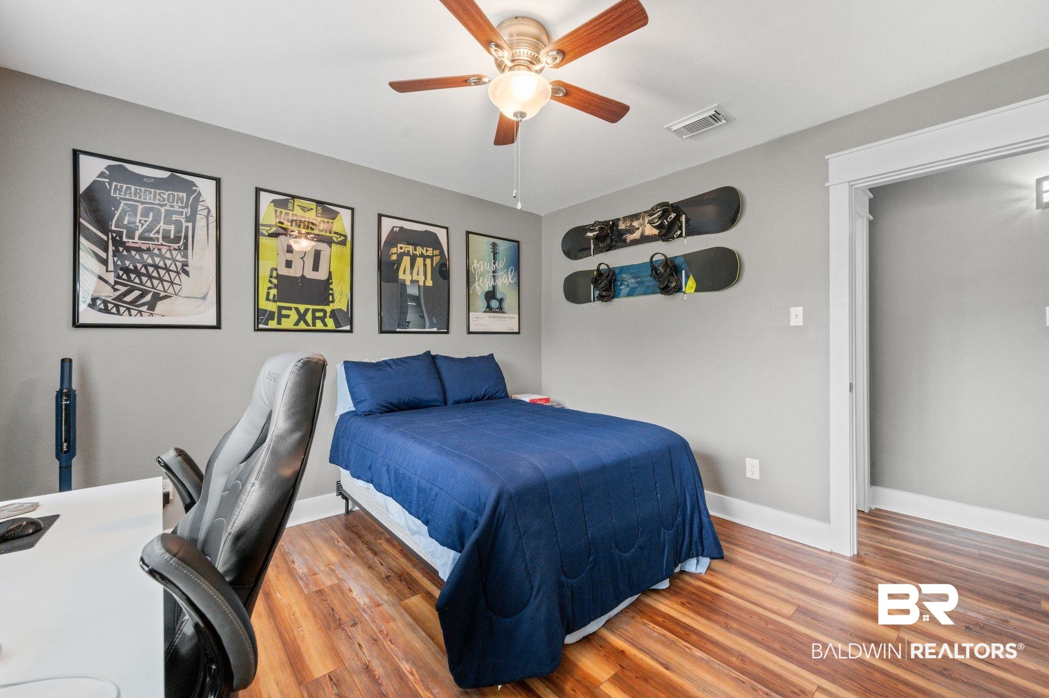 1107 North Oak Street Loxley, AL 36551 - Photo 19 of 40 Bedroom featuring ceiling fan and hardwood / wood-style floors