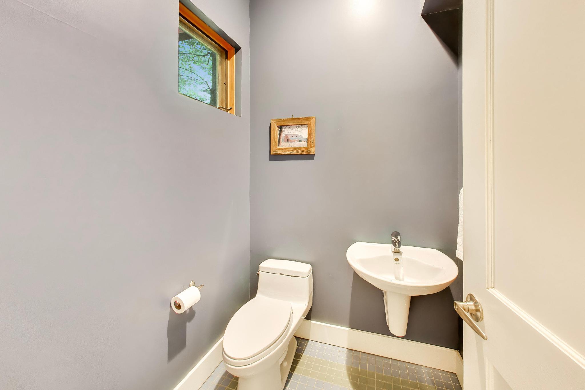 44 Tryon Farm Lane Michigan City, IN 46360 - Photo 22 of 37 a bathroom with a toilet sink and mirror
