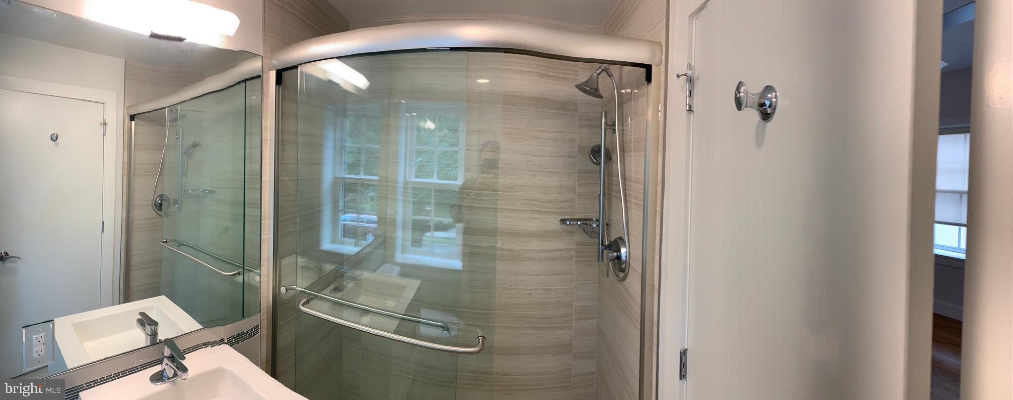 205 Witherspoon Street, Unit 2 Princeton, NJ 08542 - Photo 11 of 12 a bathroom with a glass shower door