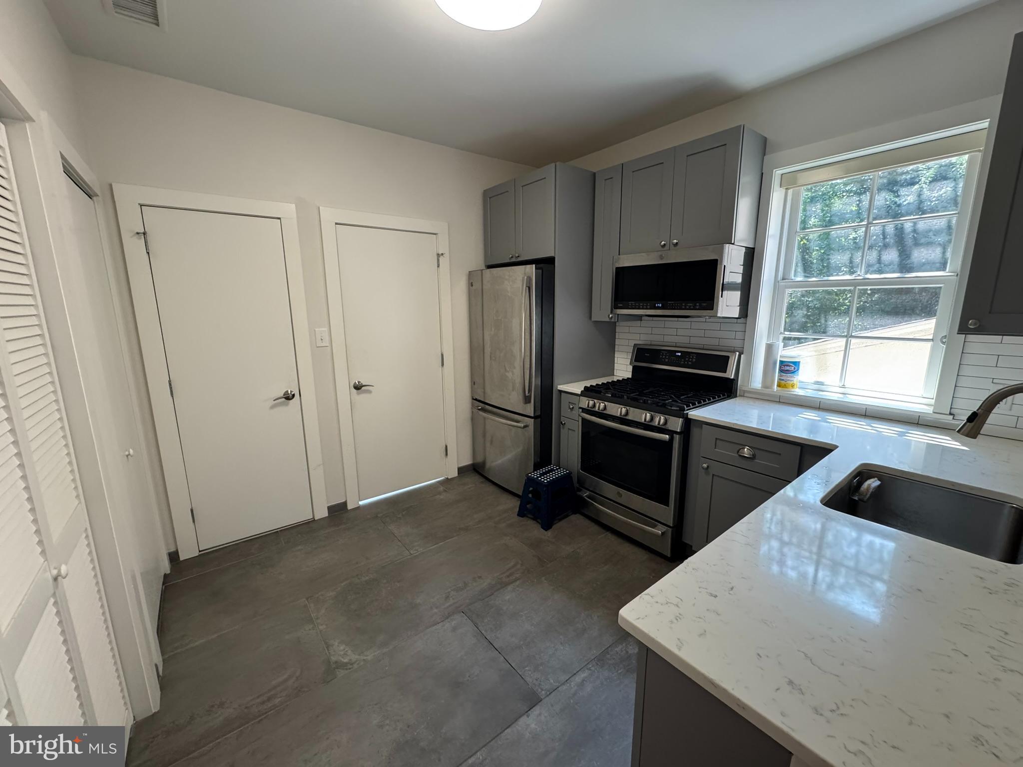 205 Witherspoon Street, Unit 2 Princeton, NJ 08542 - Photo 2 of 12 a kitchen with stainless steel appliances granite countertop a sink stove and refrigerator