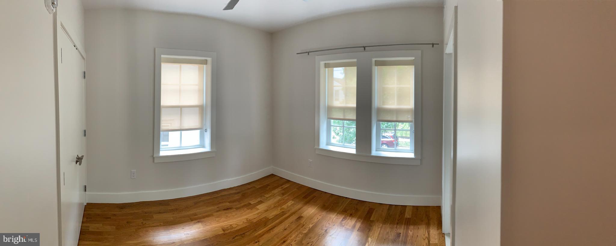 205 Witherspoon Street, Unit 2 Princeton, NJ 08542 - Photo 9 of 12 a view of empty room with wooden floor and fan
