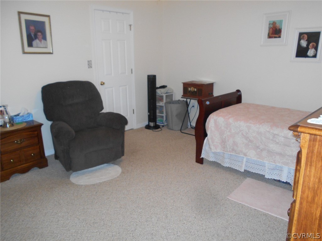 1231 Snapps Mill Road Spout Spring, VA 24593 - Photo 16 of 28 a bedroom with bed and a couch
