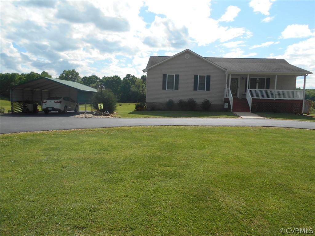 1231 Snapps Mill Road Spout Spring, VA 24593 - Photo 3 of 28 a front view of a house with a yard and trees