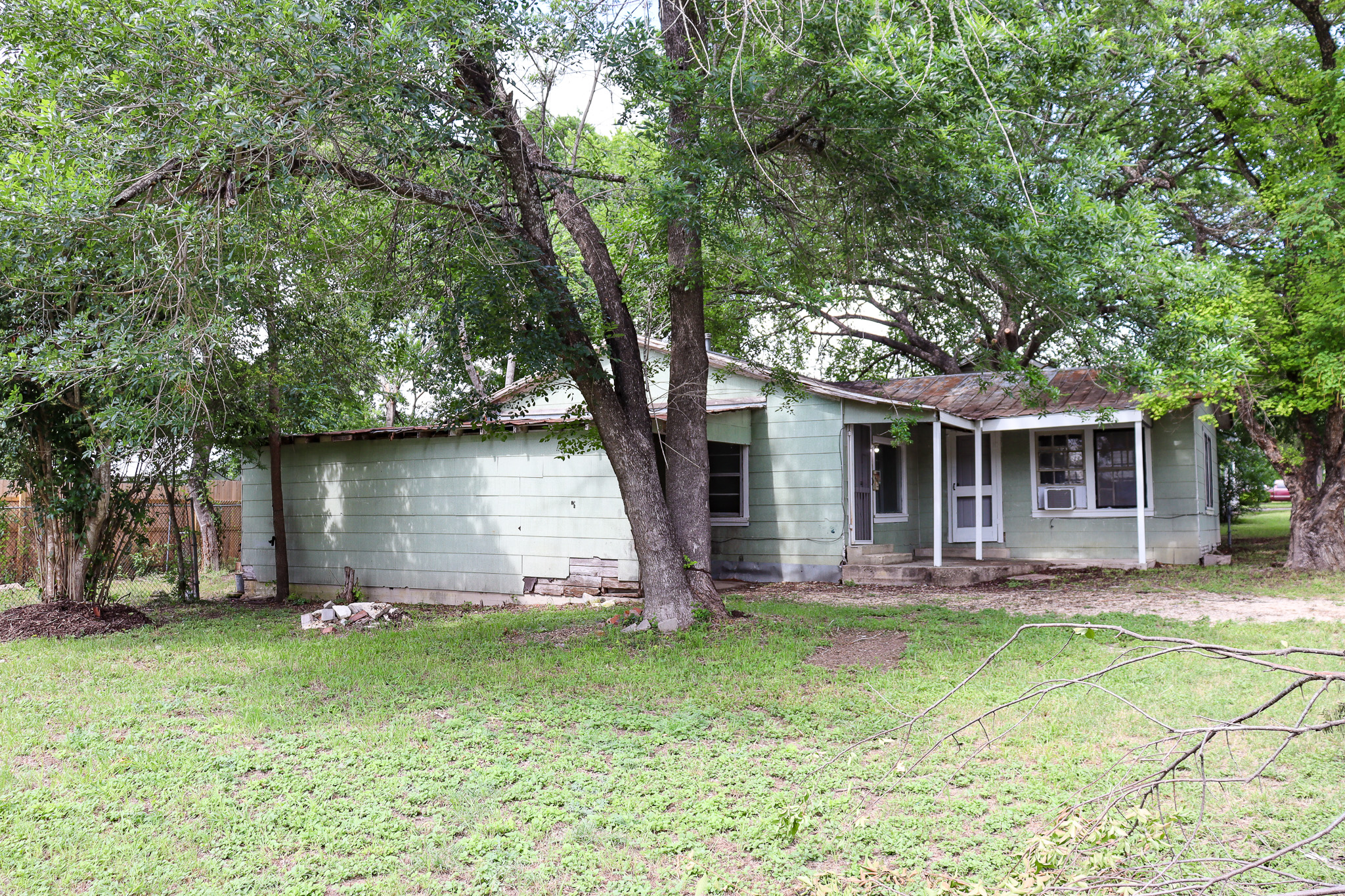 803 3rd Street Lockhart, TX 78644 - Photo 13 of 15 a front view of house with yard and green space