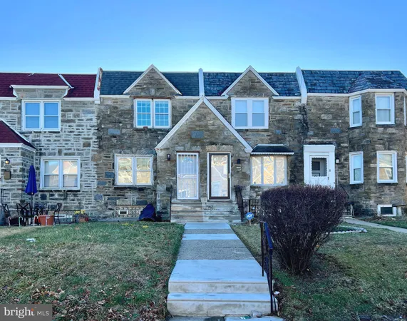 a front view of a house with yard