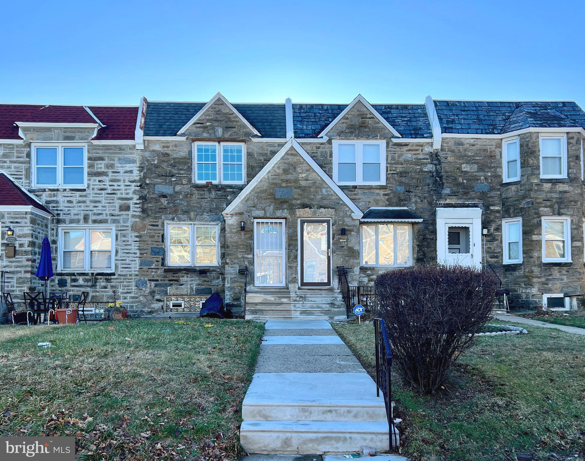 a front view of a house with yard