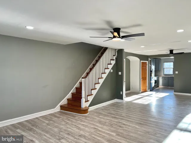 a kitchen with stainless steel appliances granite countertop a refrigerator sink and microwave