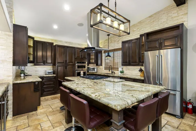 a dining room with furniture and window