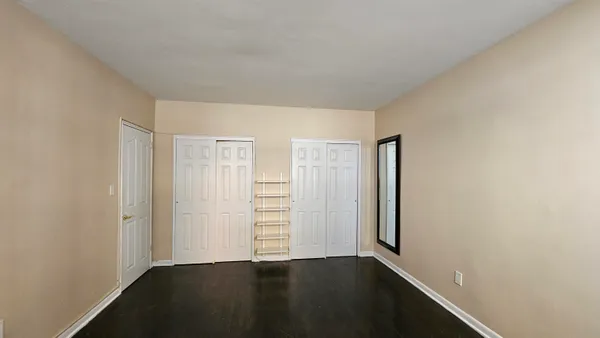 an empty room with walk in closet