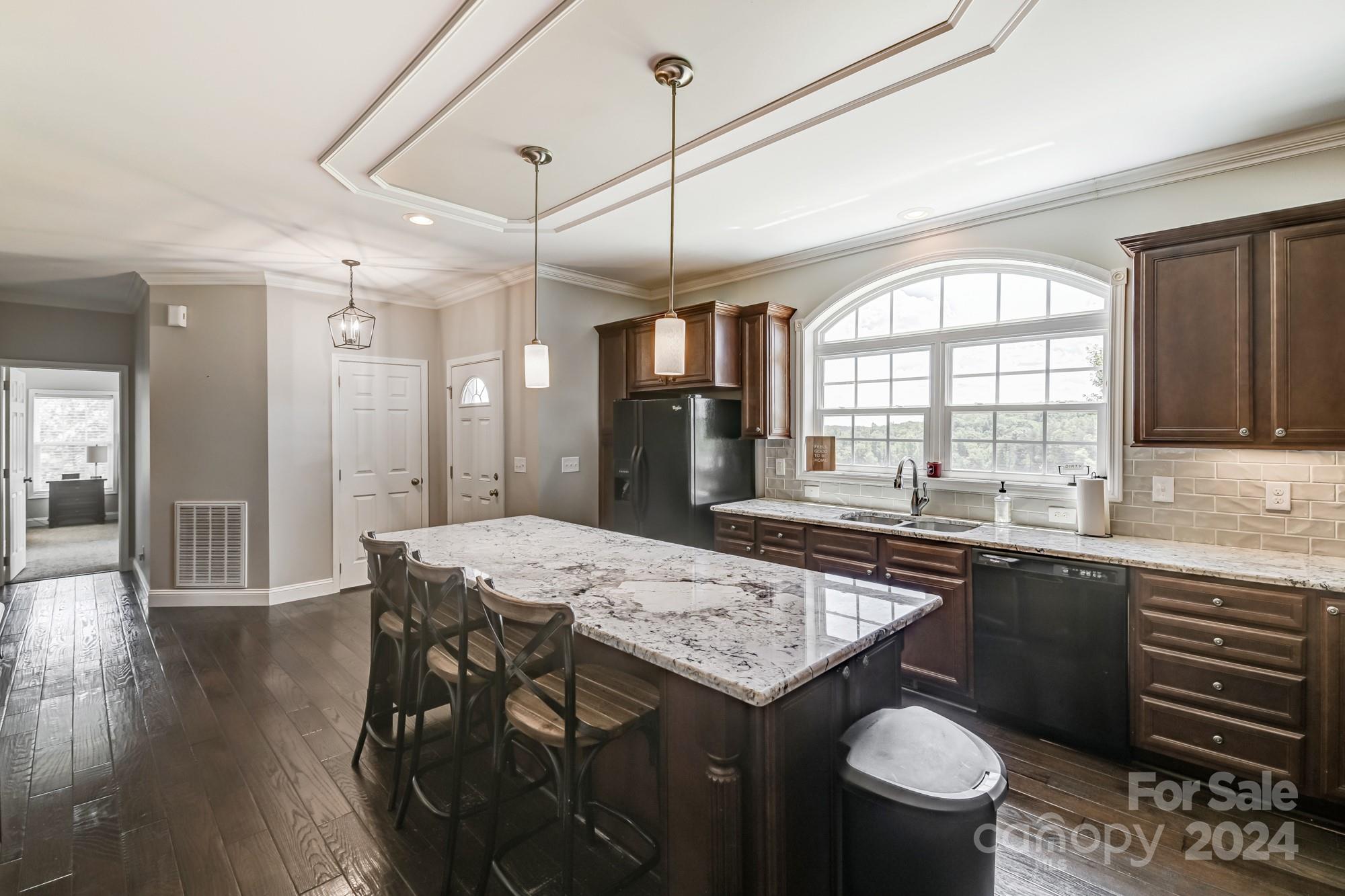 4640 Emanuel Road Gold Hill, NC 28071 - Photo 17 of 48 a kitchen with a table chairs sink and cabinets