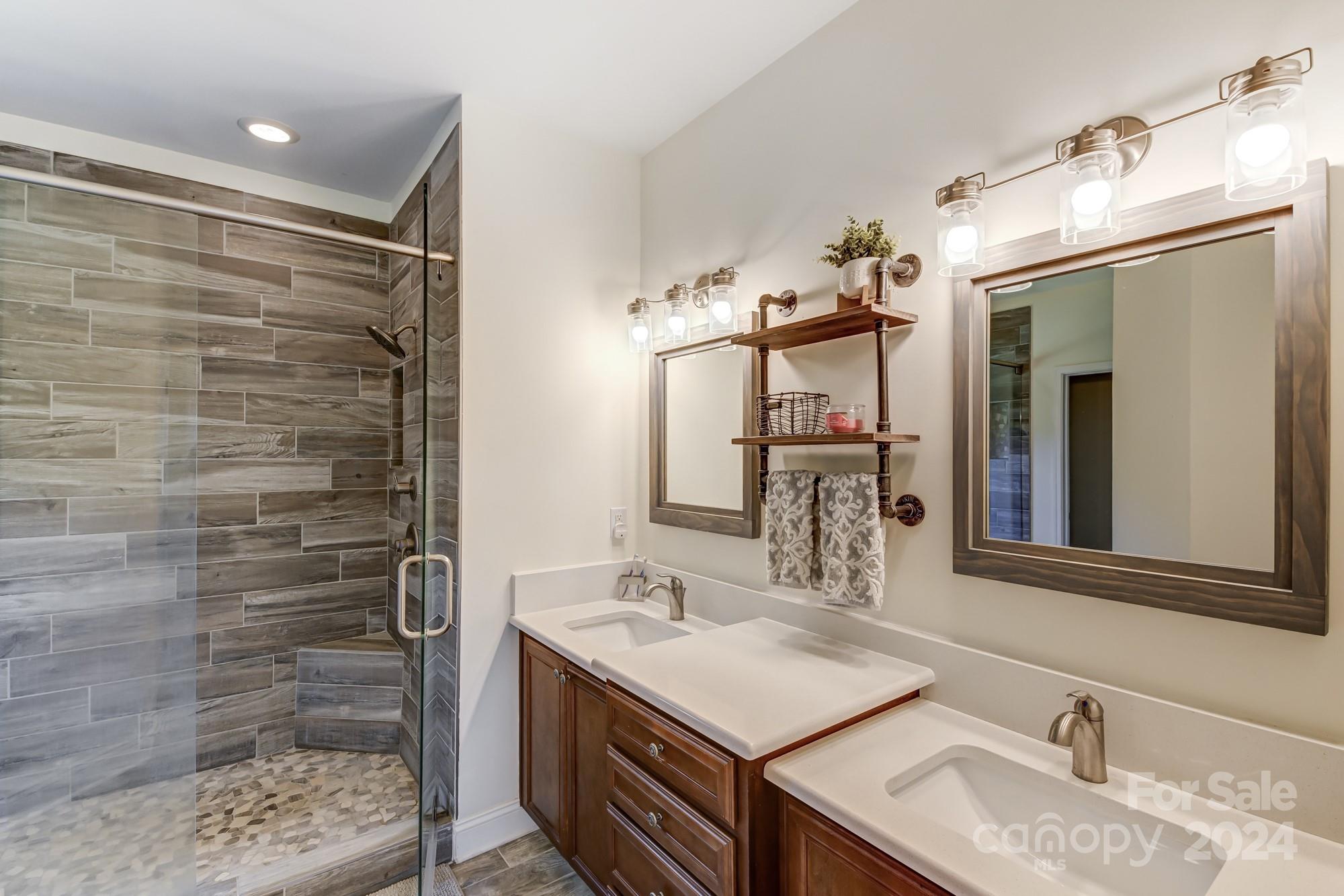 4640 Emanuel Road Gold Hill, NC 28071 - Photo 26 of 48 a bathroom with a sink vanity granite and a mirror