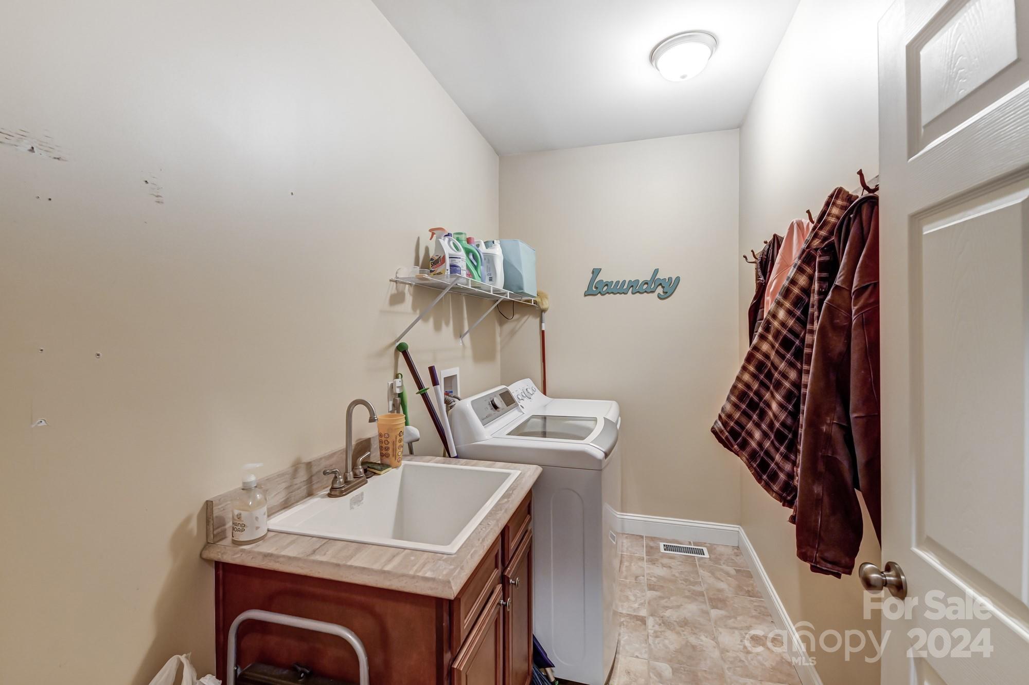 4640 Emanuel Road Gold Hill, NC 28071 - Photo 35 of 48 a bathroom with a sink and a mirror