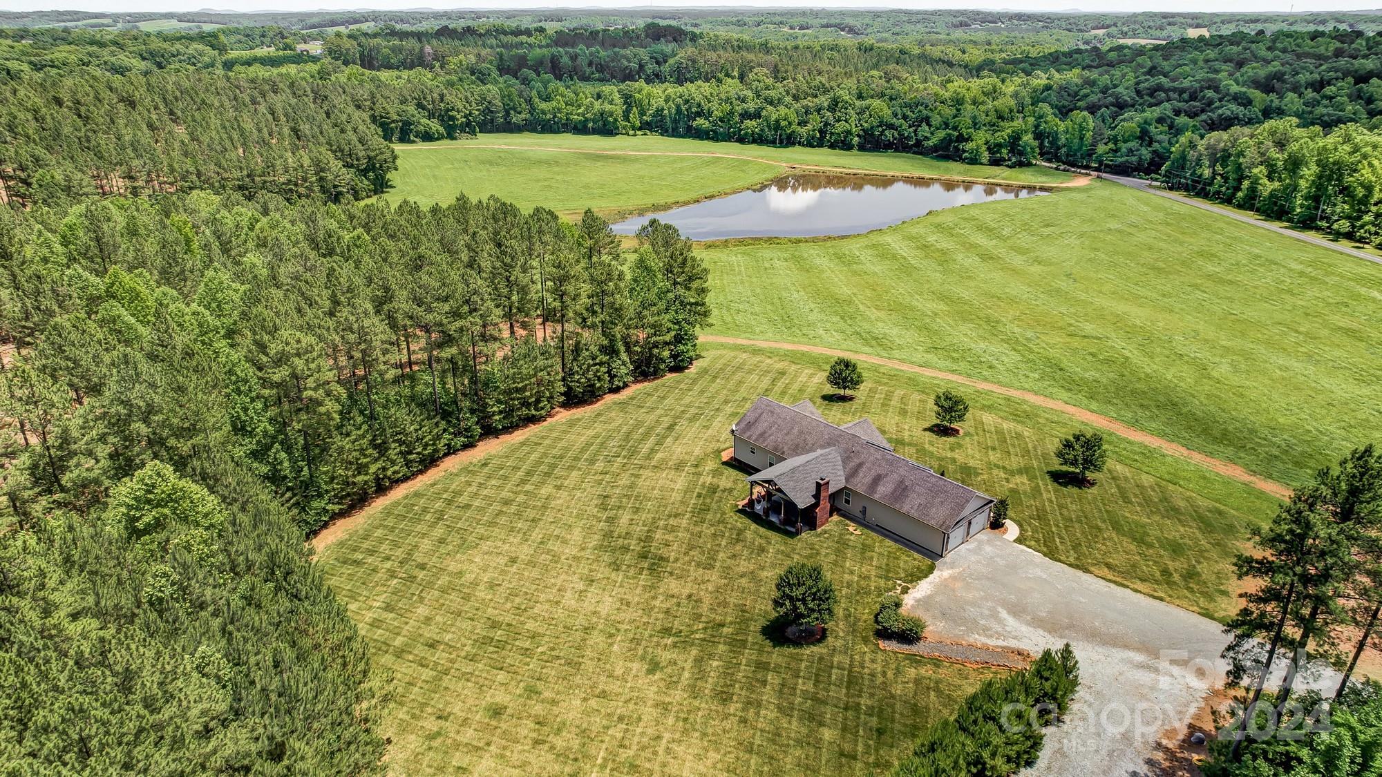 4640 Emanuel Road Gold Hill, NC 28071 - Photo 4 of 48 a view of a swimming pool with a yard
