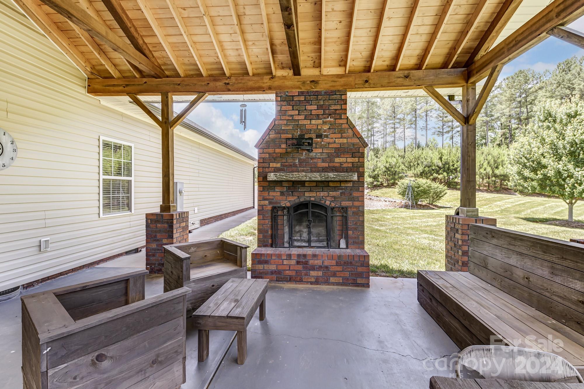 4640 Emanuel Road Gold Hill, NC 28071 - Photo 41 of 48 a living room with furniture and a fireplace