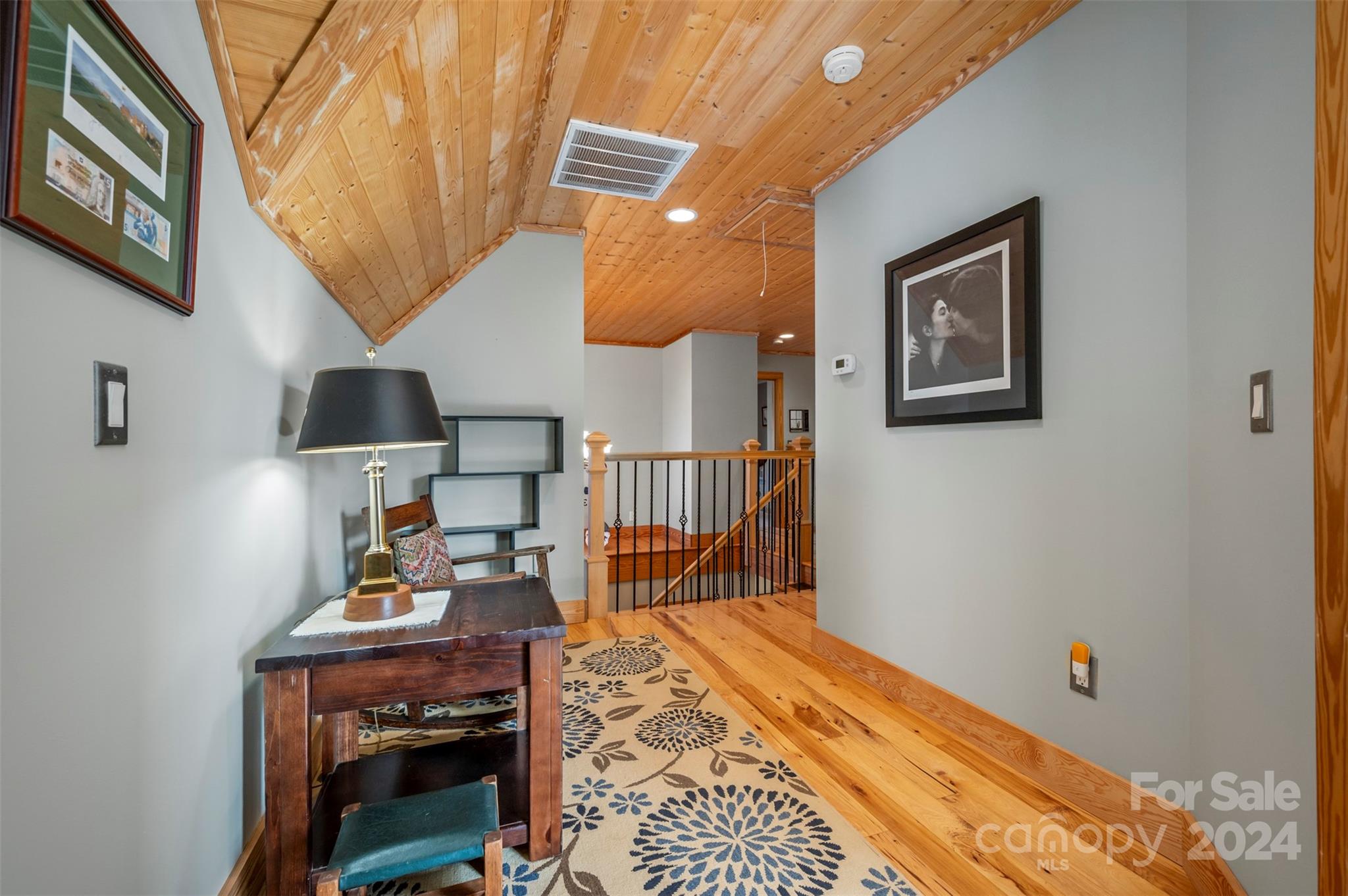 577 Edwards Road Columbus, NC 28722 - Photo 23 of 34 a bed room with a bed and a lamp