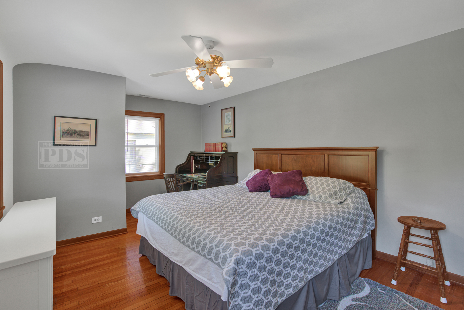 251 Lawton Road Riverside, IL 60546 - Photo 22 of 33 a bedroom with a large bed and a chandelier