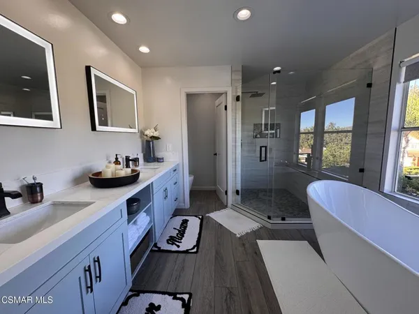 a kitchen with sink refrigerator and window