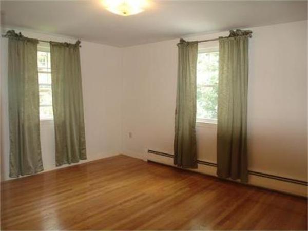 65 Follen Road Lexington, MA 02420 - Photo 13 of 23 an empty room with wooden floor and windows