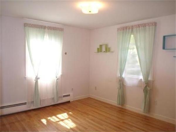 65 Follen Road Lexington, MA 02420 - Photo 14 of 23 an empty room with wooden floor and windows