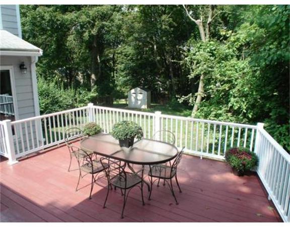 65 Follen Road Lexington, MA 02420 - Photo 20 of 23 a view of a chair and table on the deck