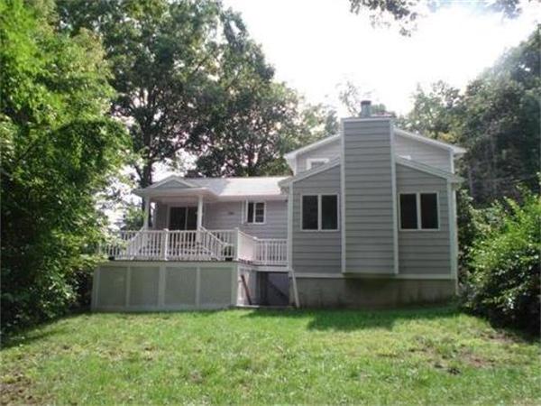 65 Follen Road Lexington, MA 02420 - Photo 2 of 23 a backyard of a house with oven and garden