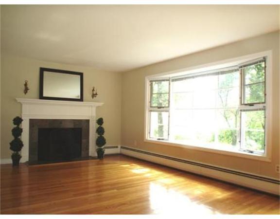 65 Follen Road Lexington, MA 02420 - Photo 3 of 23 a view of an empty room with wooden floor and a window
